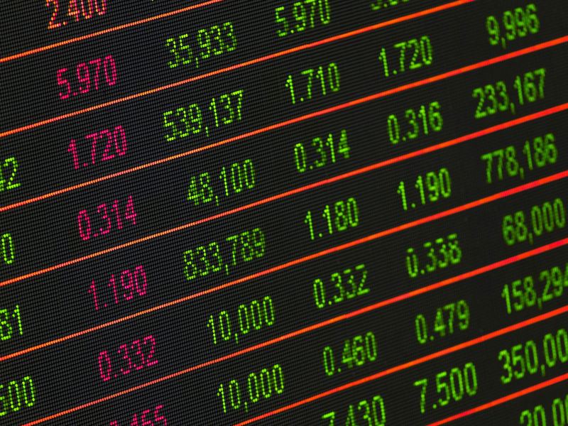 close-up of a digital stock market data display showing colorful finan image